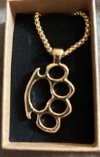 golden knuckle duster necklace