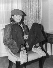 Carrie Fisher sits feet up a