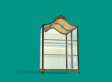 Glass Vitrine Cabinet with intricate gold accents and a timeless design piece