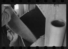 Truck unloading sacks of wheat