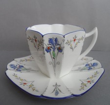 A Shelley "Blue Iris" 11561 Queen Anne shape demitasse cup & saucer. C.1927.