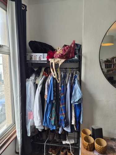 Black clothes rack space for - clothes,