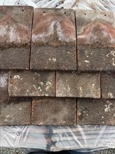 Reclaimed concrete plain tiles in red. £350 per 1000