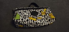 Longchamp Pokémon White/Black Cosmetics Pouch with handle.