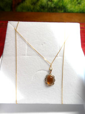 AMBER PENDANT ON 24" INCH CHAIN BOTH NINE CRT. GOLD.