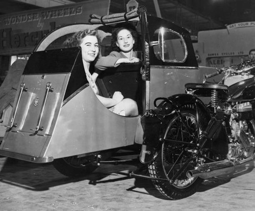 Two women sit comfortably