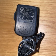 Switching Power Supply. power adapter for various devices. Model: S004LB0600030