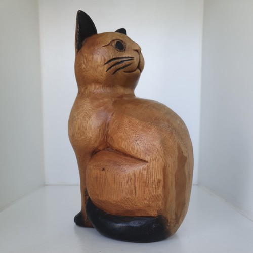 Hand carved wooden sitting cat - hand,