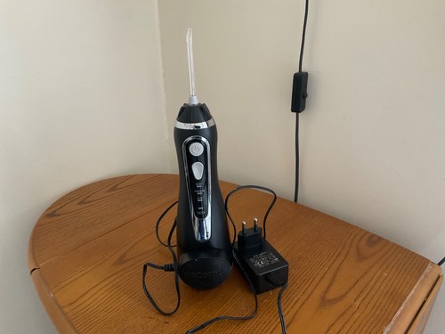 Black waterpik dental flosser