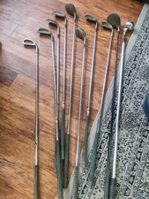 9 golf clubs and bag
