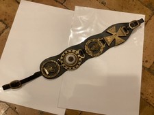 Four Antique Horse Brasses on Leather Strap