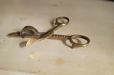 An antique brass candle