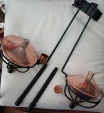 Two New  Asda outside living black and gold parasol oil lamps with snuffers.