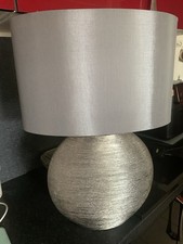 Next Table Lamp In Metallic Ribbed Silver With Mid Grey Oval Shade