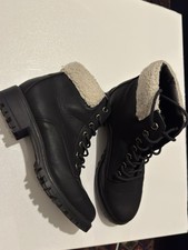 Women black ankle boots with a