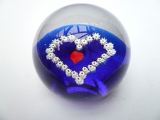Clear glass dome shaped paperweight with  blue red and white heart shape (81)