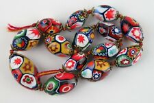 Venetian E. Moretti millefiori beads. 14 graduated oval beads