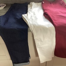 three pairs of jeans