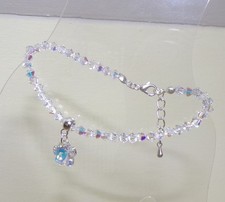 SWAROVSKI ELEMENTS BEAD CLEAR AB CRYSTAL ADJUSTABLE BRACELET WITH FLOWER CHARM?