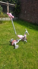 the Costway 4-in-1 Pink Kids Balance Training Trike Bike