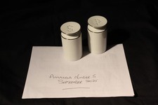 Vintage white porcelain salt & pepper shakers.  Silver trim - unused