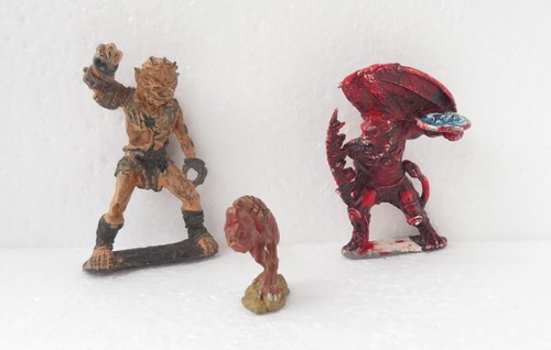 Three vintage metal figures