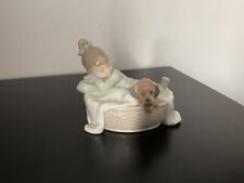 Nao - Girl in dogs Basket 1416