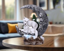White Wolves Resting on Moon
