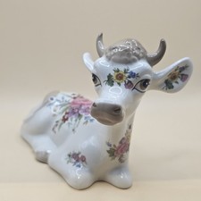 Vintage Szeiler ceramic cow figurine,  hand-painted with a floral design