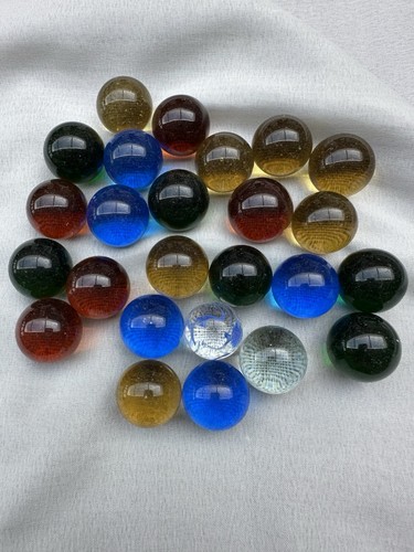 One inch glass marbles - one,