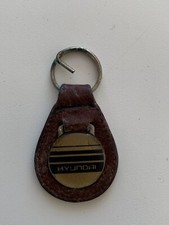 LEATHER KEYRING/ FOB DEPICTING RETRO HYUNDAI USED WORN FOB