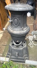 A REAL VINTAGE  CAST IRON STOVE.