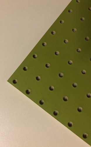 Painted green wooden pegboard - painted,