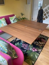 8 seat brown dining table that converts to coffee table. Lightly used.