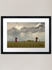Maasai women carrying a heavy
