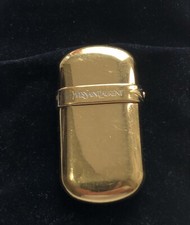 ‏Yves Saint Laurent Gold Plated Lighter With Sapphire Cabochon