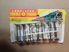 Lone Star 000/N gauge carded item No 83 telegraph/fences/people set (see text)