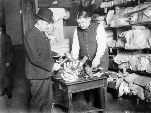 Two men holding - holding, hammers