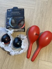 Maracas and egg shakers - and,