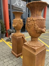 CLASSICAL URNS ON PLINTHS WITH MASKS = FRUIT. INDOOR/OUTDOOR. WOULD LOOK AMAZING