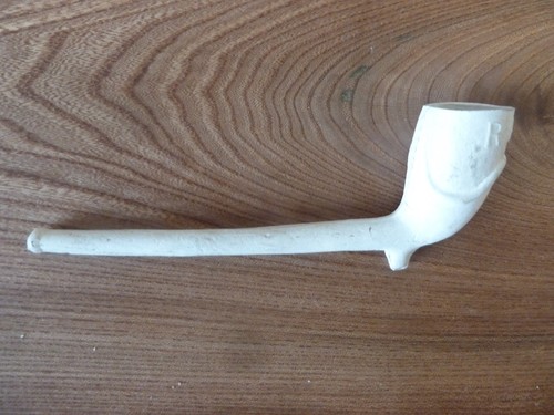 Clay pipe smoking - a,