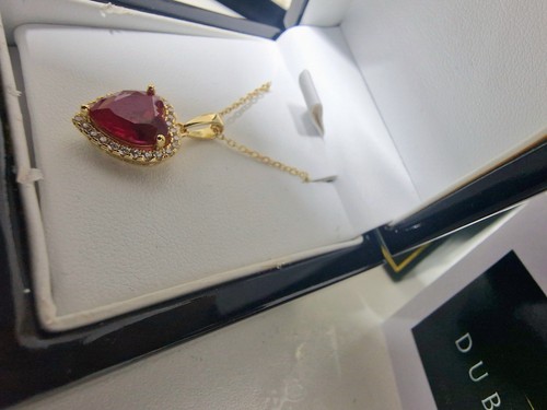 Yellow gold finished red ruby