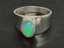 Ethiopian opal ring size O oval solitaire actual one shown. Natural stone #2