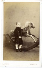 Young boy with whip by rocking horse velvet suit cdv photo