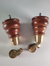 2 wooden sofa legs with brass casters wheels,  upholstery parts- to be fixed