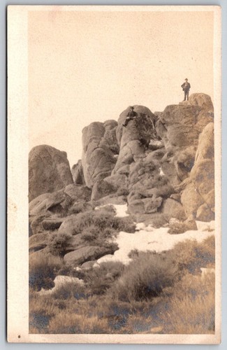 Two men rocky mountain - on,