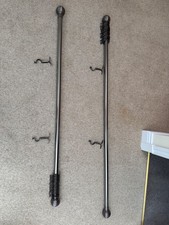 Two brushed metal curtain Rods 165 cm and 185cm, rings, brackets, globe finials.