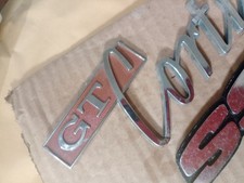 FORD GT CORTINA BADGE MK1 (DAMAGED ) CLASSIC CAR PART J.Fray Birmingham Grade B