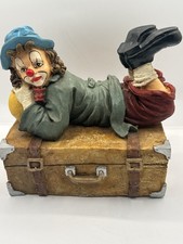 Rare Vintage Figurine Of A Clown Lying On A Suitcase Fantastic Condition.