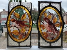 Two hand painted bird leaded